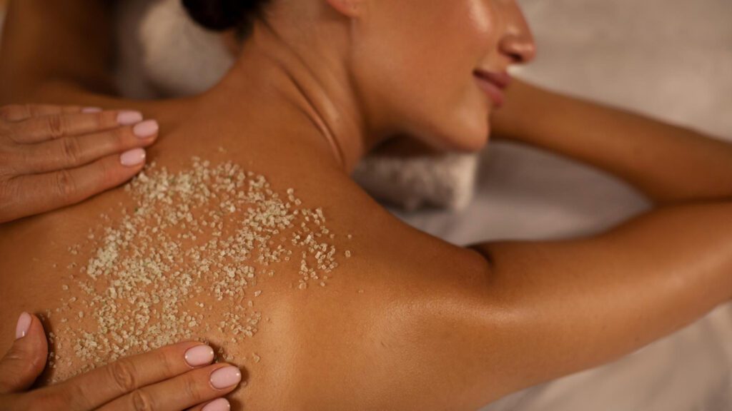 woman exfoliating to cover stretch marks