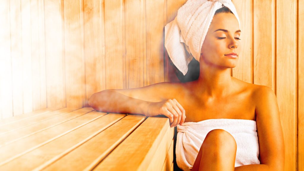 Woman relaxing in sauna