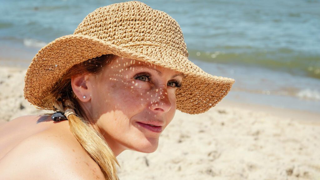 Woman wearing cap after botox