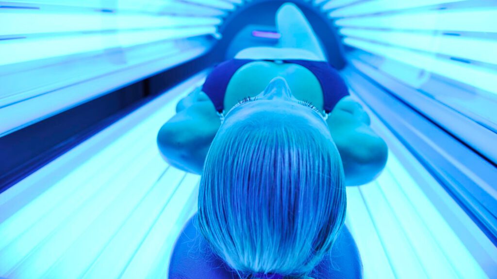 Woman using a tanning bed while pregnant
