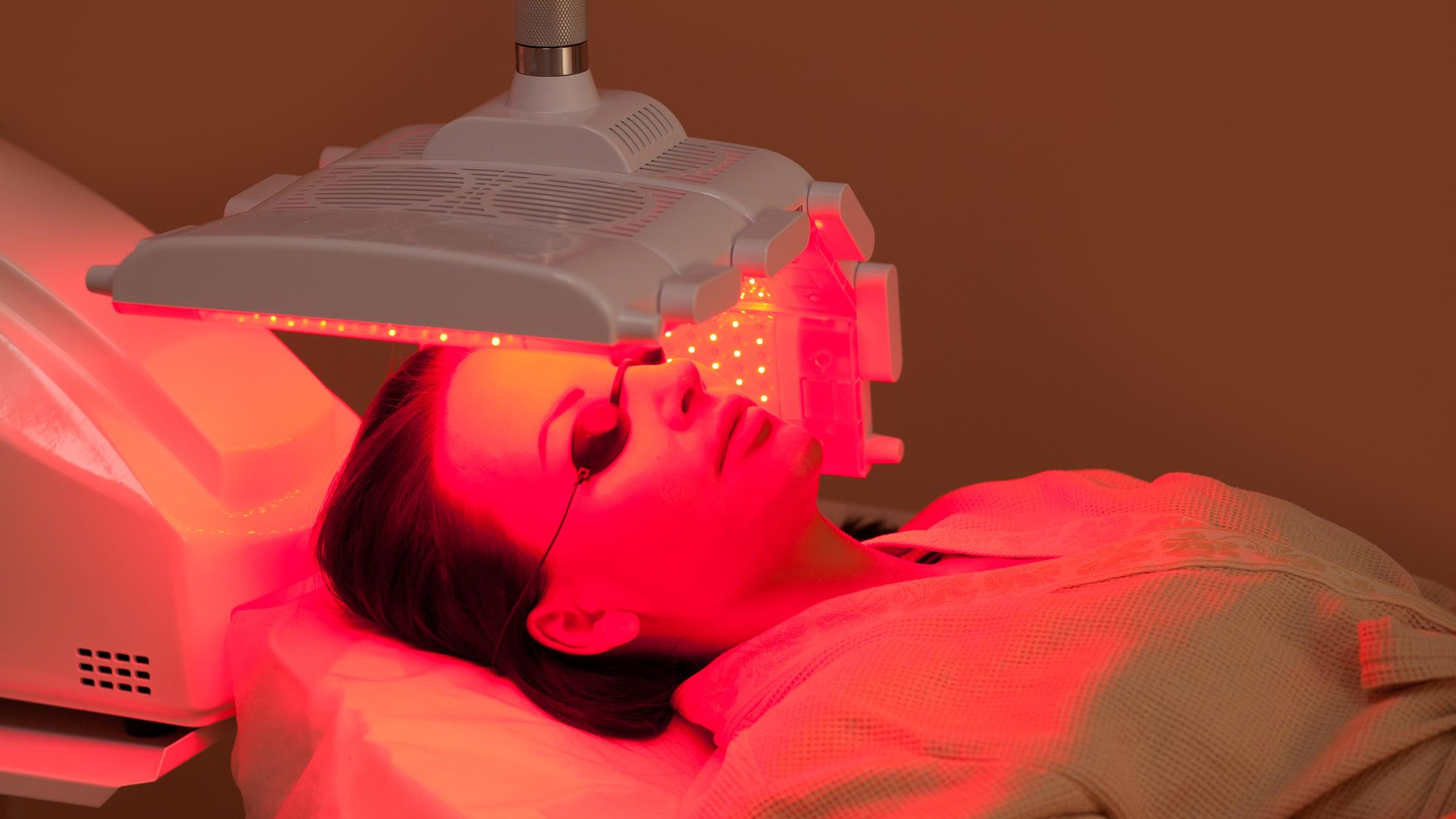 Woman having red light therapy