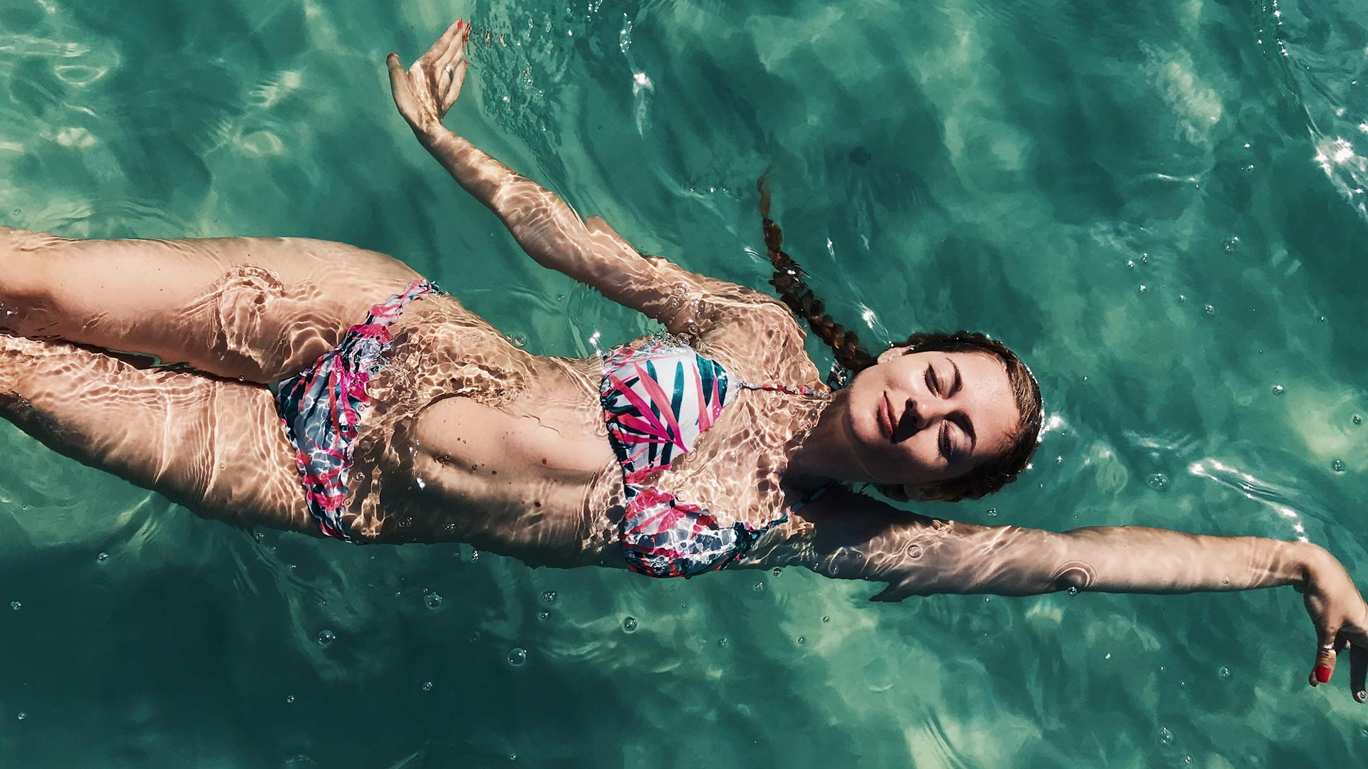Woman tanning under water