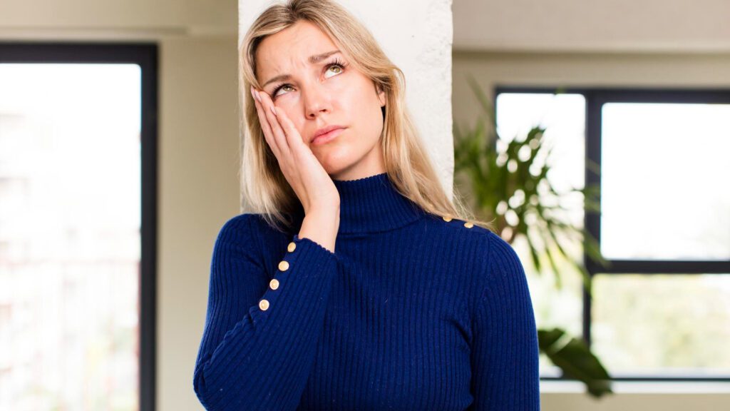 Woman touching botox injection site