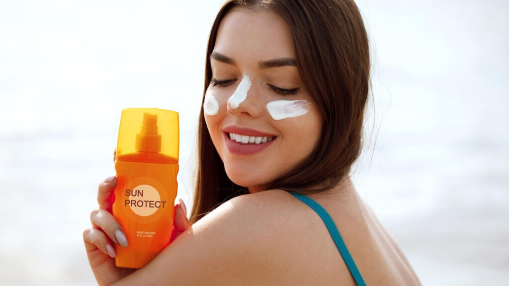 Woman using sun protection to avoid getting tan lines